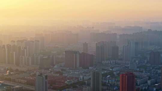 中国河南郑州清晨日出晨雾城市风光航拍