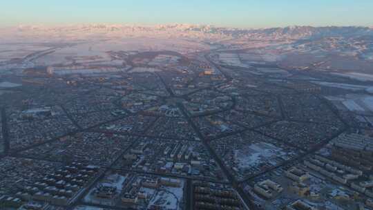 新疆北疆伊犁冬季特克斯八卦城日出高空航拍
