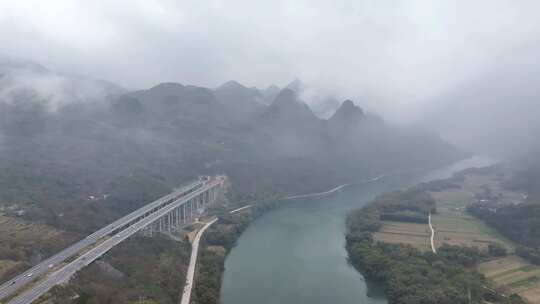 航拍云雾缭绕的广东清远连江畔高速公路