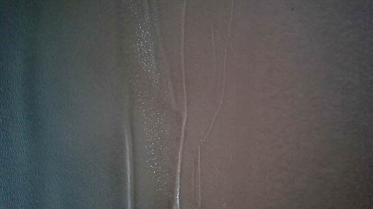 秦皇岛航拍海边沙滩海水浪花空镜