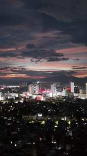 竖屏航拍城市晚霞夜景广西玉林夜景