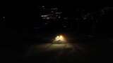 航拍吉林北大湖滑雪场夜晚压雪的压雪车高清在线视频素材下载