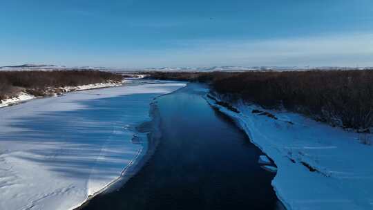 航拍呼伦贝尔河流湿地初春雪景