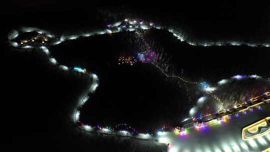航拍牙克石蓝莓小镇凤凰山景区冬天夜景灯光视频素材模板下载