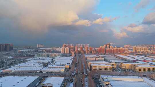 冬季航拍烟台大雪后的城市建筑和晚霞风景