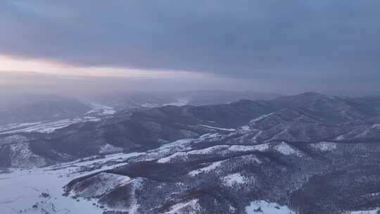 航拍寒冬山区层峦暮雪