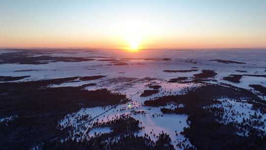 航拍林海雪原松林唯美夕阳