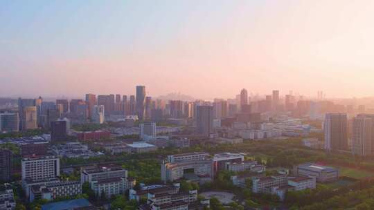 日出晨曦中的杭州滨江城市建筑风景航拍