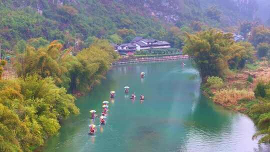 航拍春天广西桂林阳朔遇龙河竹筏漂流视频素材模板下载