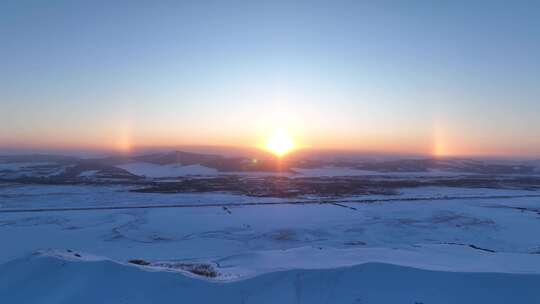 航拍呼伦贝尔雪域雪原灿烂夕阳