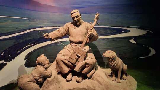 拉马头琴的蒙古族老人雕塑