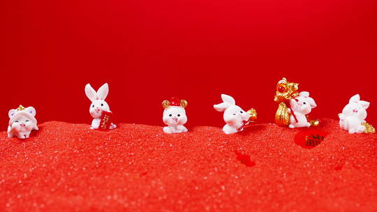 喜庆红沙上可爱兔玩具视频素材模板下载