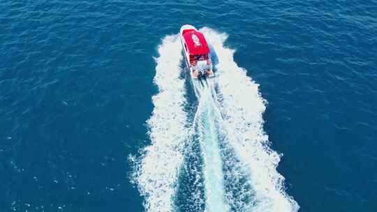 海南三亚高视角航拍海洋大海与行驶的帆船