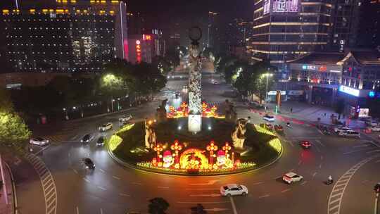 夜晚城市道路及装饰华丽的环岛景观