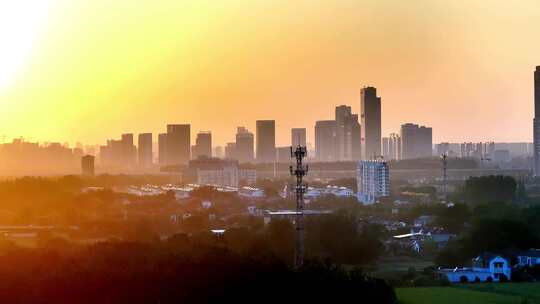 航拍扬州广陵区高楼建筑群夕阳泰达高铁黄昏