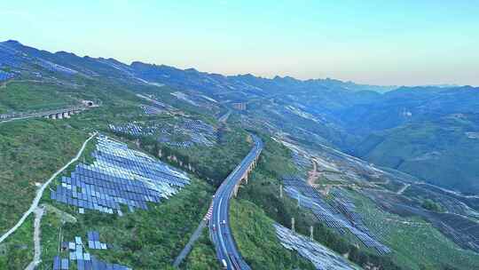 航拍高铁穿越山地光伏场