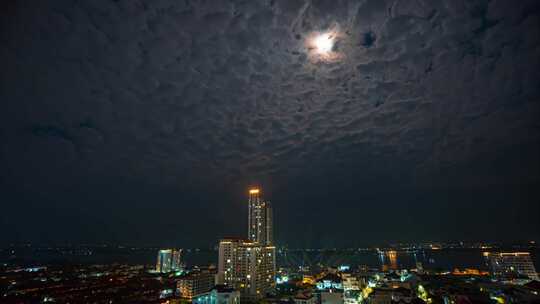 城市夜景高楼与夜空明月