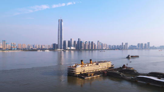 航拍武汉城市天际线高楼与长江知音号游轮