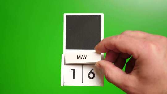 05.绿色背景上日期为5月16日的日历。