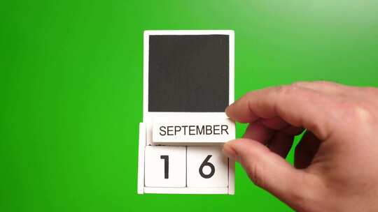 09.绿色背景上日期为9月16日的日历。