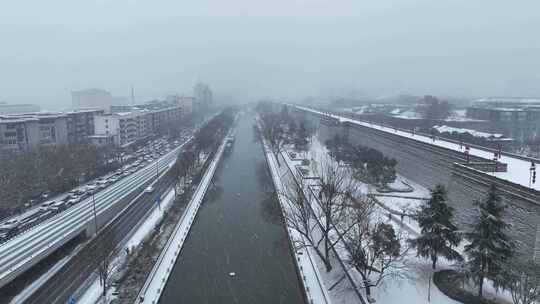 航拍陕西省西安市西安城墙下的护城河雪景
