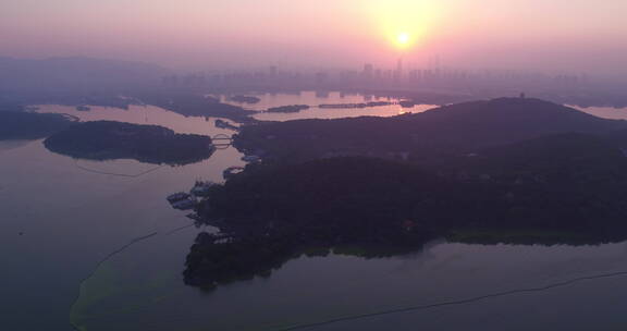 旅游景区 航拍鼋头渚太湖仙岛日出光线右转