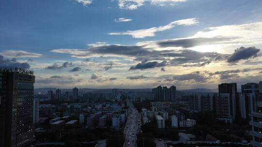 航拍城市雨后烟囱、云、建筑群