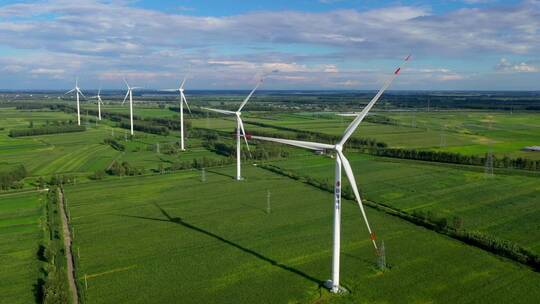 航拍农田里的新能源风机风车 环保绿色能源
