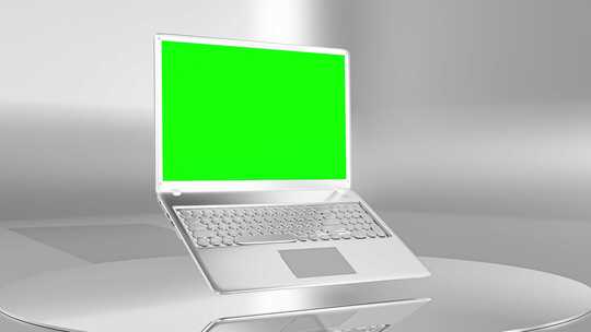 白色电脑带有绿幕的屏幕