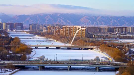 中国内蒙古呼和浩特马头琴桥冬天天际线风光视频素材模板下载
