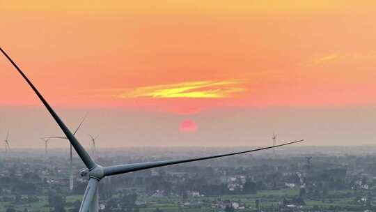 航拍乡村农田池塘夕阳火烧云风力发电素材