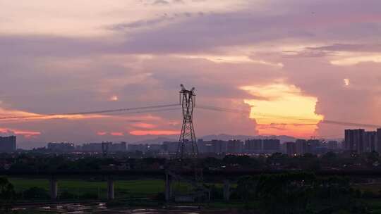 夕阳日落高铁电塔城市