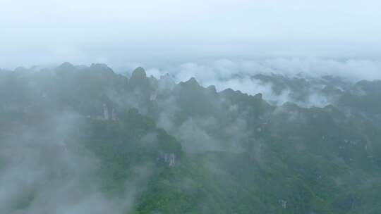 航拍大自然山林间的巍峨山峰俯瞰4k素材