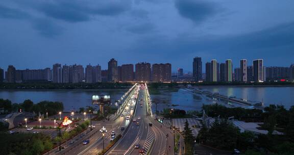 4k城市洛阳河流航拍蓝调时刻城市夜景