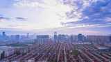 日出多云天空下的杭州滨江城市建筑风光延时高清在线视频素材下载