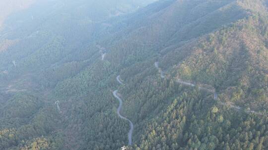 航拍绿色森林蜿蜒盘山公路视频素材模板下载