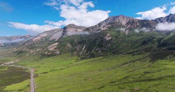 川西雪山下的草原河流大气航拍视频