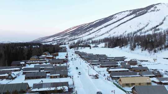 航拍新疆冬季喀纳斯湖雪景雪山森林冰河寒冷