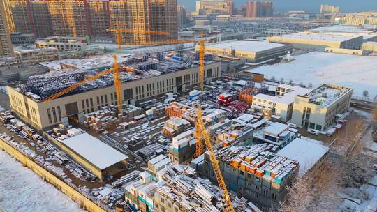 冬季航拍烟台大雪后的城市建筑和晚霞风景