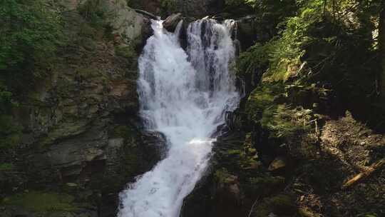 航拍山间河流溪流瀑布流水原始森林