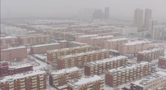 航拍雪后楼群 冬季城市高楼住宅雪后景色