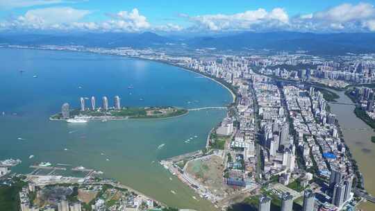 海南三亚城市蓝天白云建筑凤凰岛全景海岸线