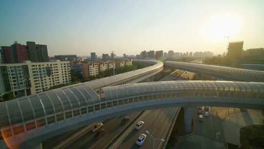 武汉光谷航拍室外量子号立交桥车夕阳大货车