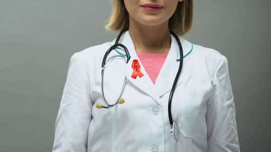 红丝带摆姿势拍照的女医生，艾滋病意识，性
