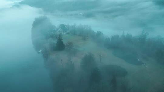 无人机在温德米尔湖中央的一个岛屿上空盘旋