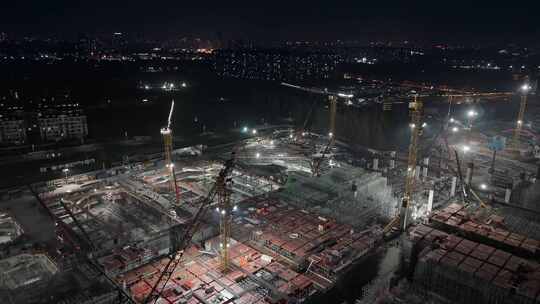 航拍鸟瞰上海松江枢纽建筑工地夜景