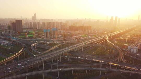 航拍夕阳下杭州萧山机场城市大道高架车流
