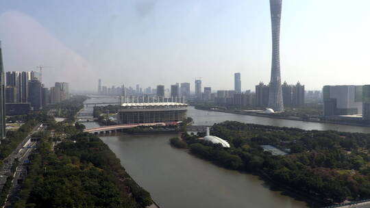航拍广州珠江两岸的广州塔及海心沙体育场