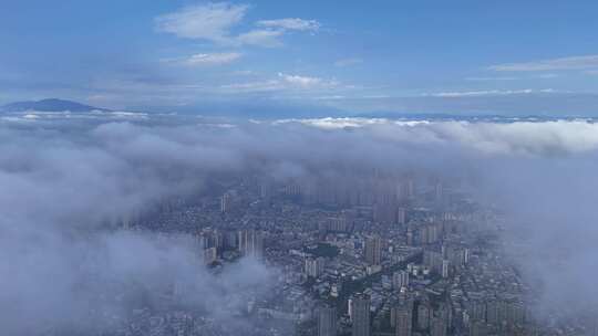 云海下的城市高楼四川乐山航拍