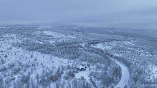 航拍穿越林海雪原的山路